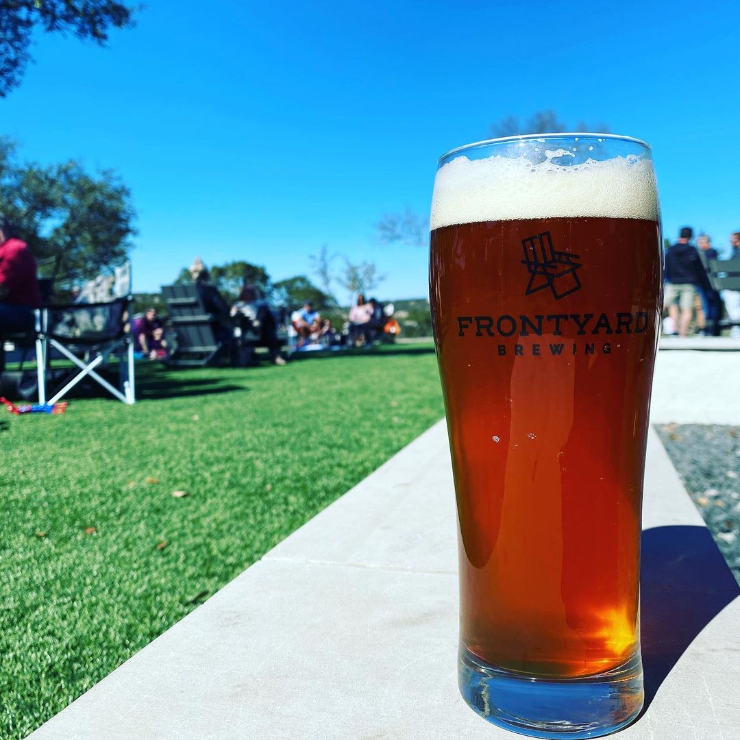 frontyard brewing in austin with beer glass