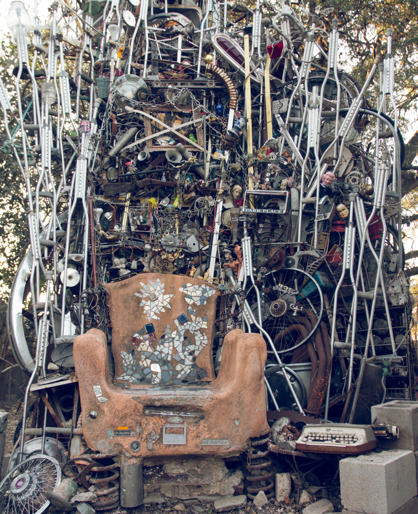 old chair with other junk at the cathedral of junk in austin texas